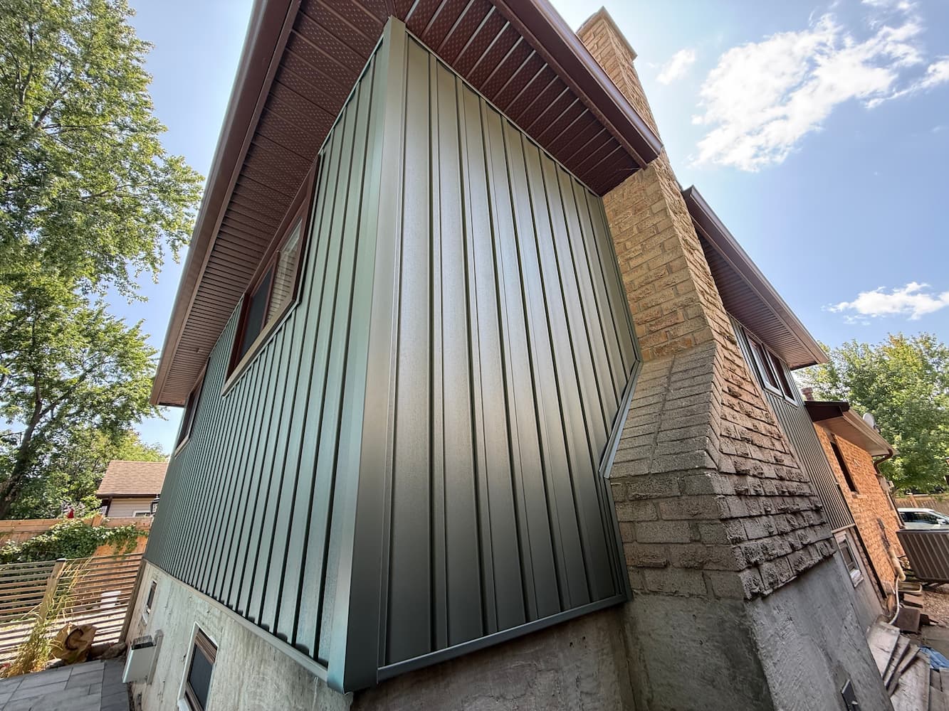 Close-up of new vertical siding installation