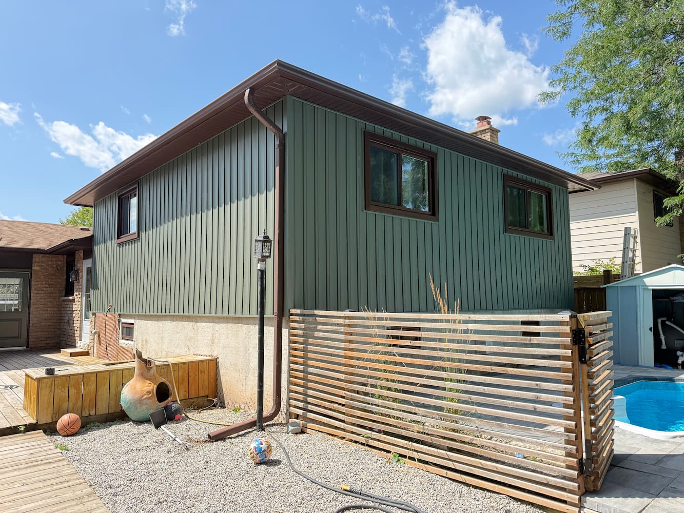 Home exterior with new vertical siding, side view
